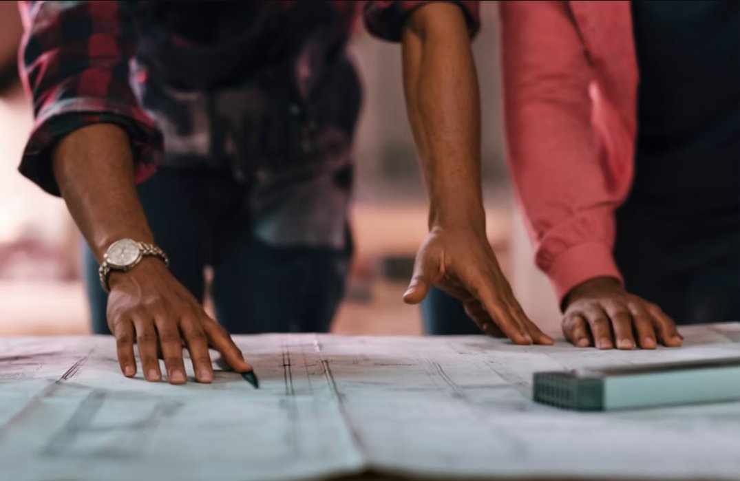 Architect and client looking at site plans